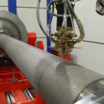 Laser cladding process restoring worn piston rod surface of a 2-stroke SULZER RTA 58 engine at KIMI workshop.