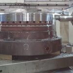 Cylinder cover reconditioning in progress — fine machining of critical surfaces for dimensional restoration.