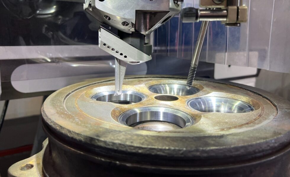 Machining of pockets and valve seats during 4-stroke cylinder cover reconditioning at KIMI’s precision workshop.
