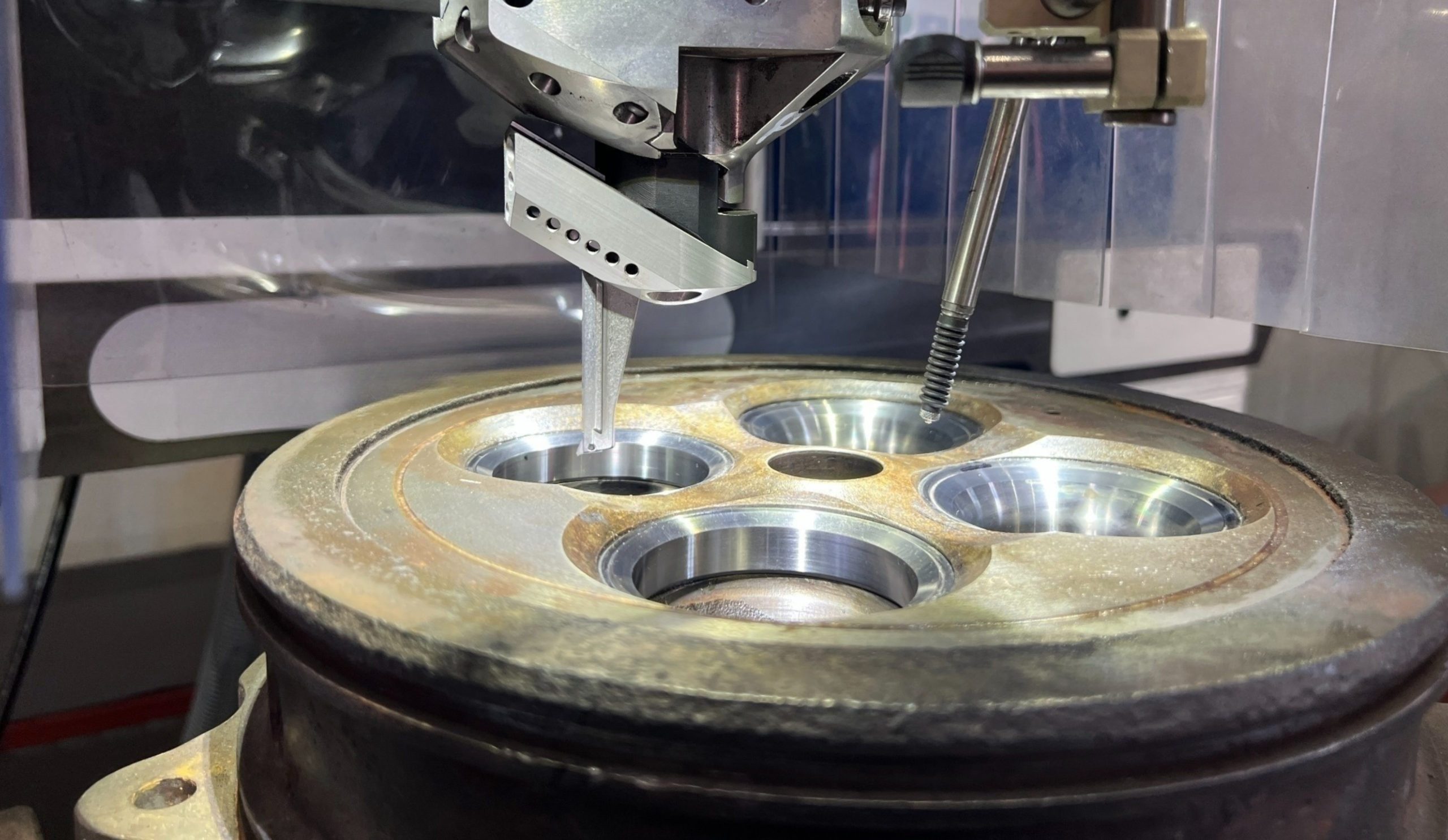 Machining of pockets and valve seats during 4-stroke cylinder cover reconditioning at KIMI’s precision workshop.