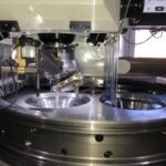 Grinding of pockets and valve seats during 4-stroke cylinder cover reconditioning at KIMI’s workshop.