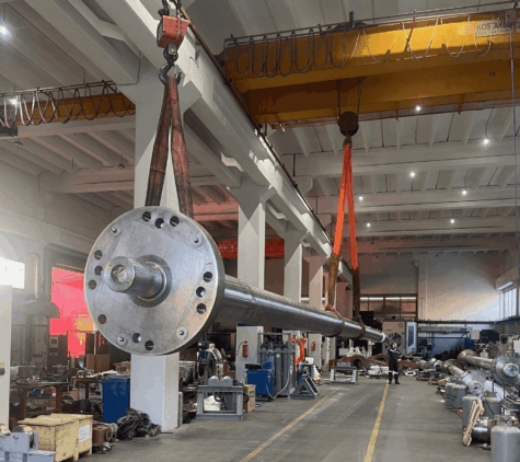 KIMI technicians performing propulsion shaft repair and precision machining for marine propulsion systems