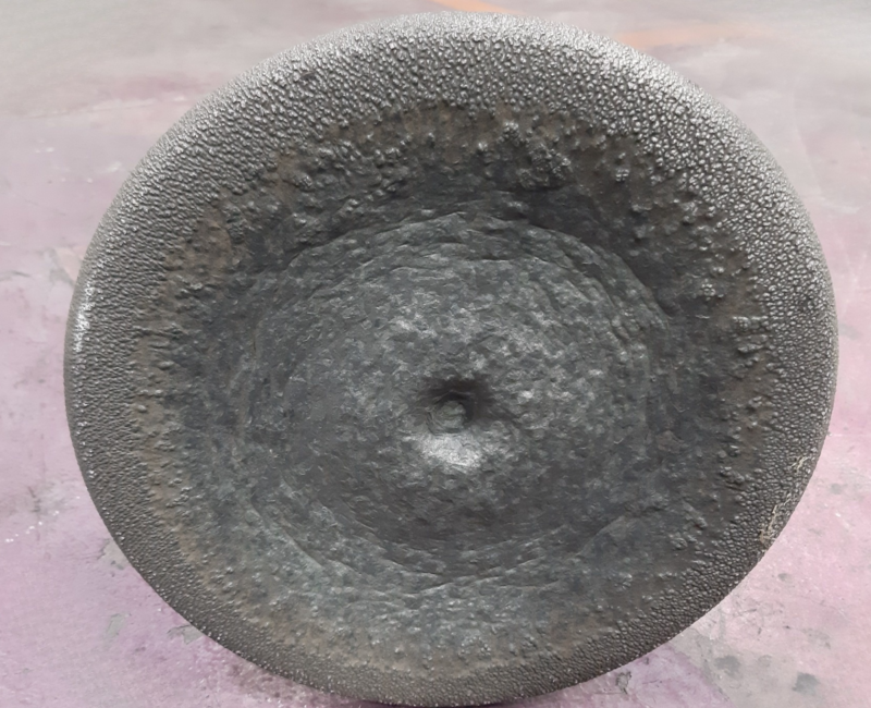 Severe burn-off damage on exhaust valve face before reconditioning